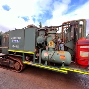 Cubex QXR920 right side view showing the compressor unit, engine, and crawler track frame