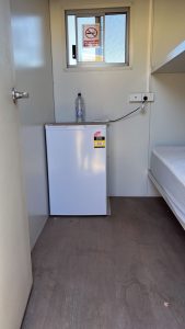 Single fridge and bunk bed inside custom 6 MAN accommodation