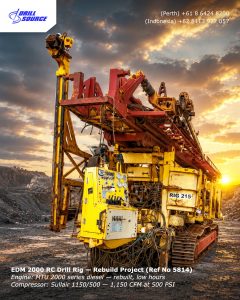 Yellow EDM 2000 RC drill rig on a rocky site at sunset, with Drill Source branding visible in the corner.